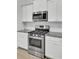 Stainless steel range and microwave in a modern kitchen setting at 9991 Winged Elm St, Ladson, SC 29456