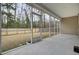 Screened porch overlooking fenced backyard at 9991 Winged Elm St, Ladson, SC 29456