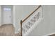 Staircase with wooden railing and carpeted steps at 9991 Winged Elm St, Ladson, SC 29456