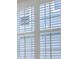 White window with plantation shutters at 9991 Winged Elm St, Ladson, SC 29456