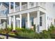Charming two-story home with a porch swing and landscaping at 1073 Keeper Ln, Summerville, SC 29485