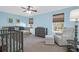 Bedroom with light blue walls, plenty of natural light, and a crib at 109 Historic Dr, Mount Pleasant, SC 29464
