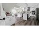 Modern kitchen with white cabinets, granite counters, and two islands at 109 Historic Dr, Mount Pleasant, SC 29464