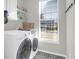 Bright laundry room with washer, dryer, and window at 109 Historic Dr, Mount Pleasant, SC 29464