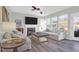Spacious living room with hardwood floors, fireplace, and access to deck at 109 Historic Dr, Mount Pleasant, SC 29464
