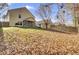 Large backyard with wooden fence and scattered leaves at 114 Avalon Rd, Summerville, SC 29483