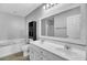 Double vanity bathroom with a large mirror and tub at 114 Avalon Rd, Summerville, SC 29483