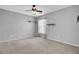 Simple bedroom with neutral walls, ceiling fan, and floating shelves at 114 Avalon Rd, Summerville, SC 29483