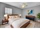 Spacious bedroom with wood bed frame, neutral decor, and ceiling fan at 114 Avalon Rd, Summerville, SC 29483