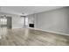 Spacious dining area with wood-look floors and modern light fixture at 114 Avalon Rd, Summerville, SC 29483