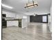 Open kitchen with white cabinets, granite counters, and stainless steel appliances at 114 Avalon Rd, Summerville, SC 29483