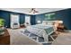 Main bedroom with deep blue walls and a king-size bed at 114 Avalon Rd, Summerville, SC 29483