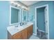 Double vanity bathroom with modern light fixtures at 1295 Island Club Dr # E, Charleston, SC 29492