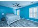 Primary bedroom with gray bedding and ceiling fan at 1295 Island Club Dr # E, Charleston, SC 29492