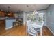 Bright dining room with white table, chairs, and a view into the kitchen at 1295 Island Club Dr # E, Charleston, SC 29492