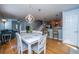 Dining room with white table and chairs and a view into the kitchen and living room at 1295 Island Club Dr # E, Charleston, SC 29492