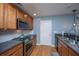 Modern kitchen with stainless steel appliances and wood cabinets at 1295 Island Club Dr # E, Charleston, SC 29492