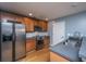Stainless steel appliances and wood cabinets in this updated kitchen at 1295 Island Club Dr # E, Charleston, SC 29492