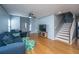 Hardwood floor living room with sectional sofa and stairs to the second floor at 1295 Island Club Dr # E, Charleston, SC 29492