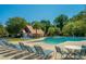 Community pool with lounge chairs and cabana at 1295 Island Club Dr # E, Charleston, SC 29492