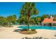 Community pool with palm trees and lounge chairs at 1295 Island Club Dr # E, Charleston, SC 29492