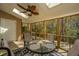 Screened porch with outdoor seating and wooded views at 1295 Island Club Dr # E, Charleston, SC 29492