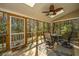 Relaxing screened porch with seating and ceiling fan at 1295 Island Club Dr # E, Charleston, SC 29492