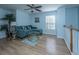 Upstairs sitting area with sectional sofa and wood flooring at 1295 Island Club Dr # E, Charleston, SC 29492
