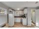 Bright studio kitchen with white cabinets and appliances at 1321 Erckmann Dr, Mount Pleasant, SC 29464