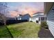 Green grassy backyard, partially fenced, with home view at 176 Callibluff Dr, Summerville, SC 29486