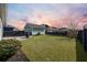 Large grassy backyard with a shed and privacy fence at 176 Callibluff Dr, Summerville, SC 29486