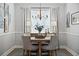 Bright dining room features a round table and four chairs at 176 Callibluff Dr, Summerville, SC 29486