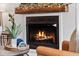 Modern fireplace with a rustic wood mantel at 176 Callibluff Dr, Summerville, SC 29486