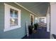 Inviting front porch with plants and seating at 176 Callibluff Dr, Summerville, SC 29486