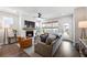Spacious living room with fireplace, hardwood floors, and access to patio at 176 Callibluff Dr, Summerville, SC 29486