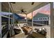 Relaxing screened porch with wicker furniture at 176 Callibluff Dr, Summerville, SC 29486