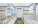 Spa-like bathroom with granite countertop and large shower at 192 Collared Dove Ct, Summerville, SC 29483