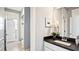 Small bathroom with white vanity and black countertop at 192 Collared Dove Ct, Summerville, SC 29483