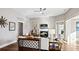 Open living space with fireplace, sunroom access, and hardwood floors at 192 Collared Dove Ct, Summerville, SC 29483