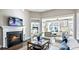 Living area with cozy fireplace and views to sunroom at 192 Collared Dove Ct, Summerville, SC 29483