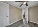 Bedroom with ceiling fan and view into kitchen area at 1984 Hugo Ave, North Charleston, SC 29405