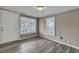 Cozy bedroom with grey floors and exterior access at 1984 Hugo Ave, North Charleston, SC 29405