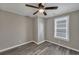 Well-lit bedroom with grey flooring and ceiling fan at 1984 Hugo Ave, North Charleston, SC 29405