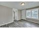Simple bedroom with grey flooring and two windows at 1984 Hugo Ave, North Charleston, SC 29405