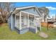 Charming blue house with white trim and a covered porch at 1984 Hugo Ave, North Charleston, SC 29405