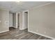 Clean hallway with grey flooring and multiple room access at 1984 Hugo Ave, North Charleston, SC 29405