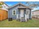 Cute blue house with white trim and small porch at 1984 Hugo Ave, North Charleston, SC 29405