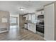 Updated kitchen, white cabinets, granite counters, and stainless steel appliances at 1984 Hugo Ave, North Charleston, SC 29405