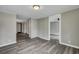 Spacious living room with grey floors and access to other rooms at 1984 Hugo Ave, North Charleston, SC 29405