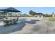 Community patio area with tables and umbrellas for residents at 199 Schooner Bend Ave, Summerville, SC 29486